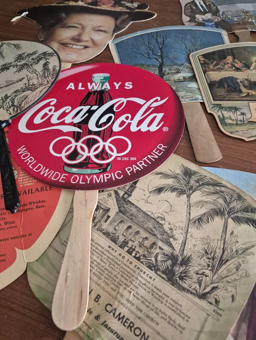 Assorted vintage advertising fans